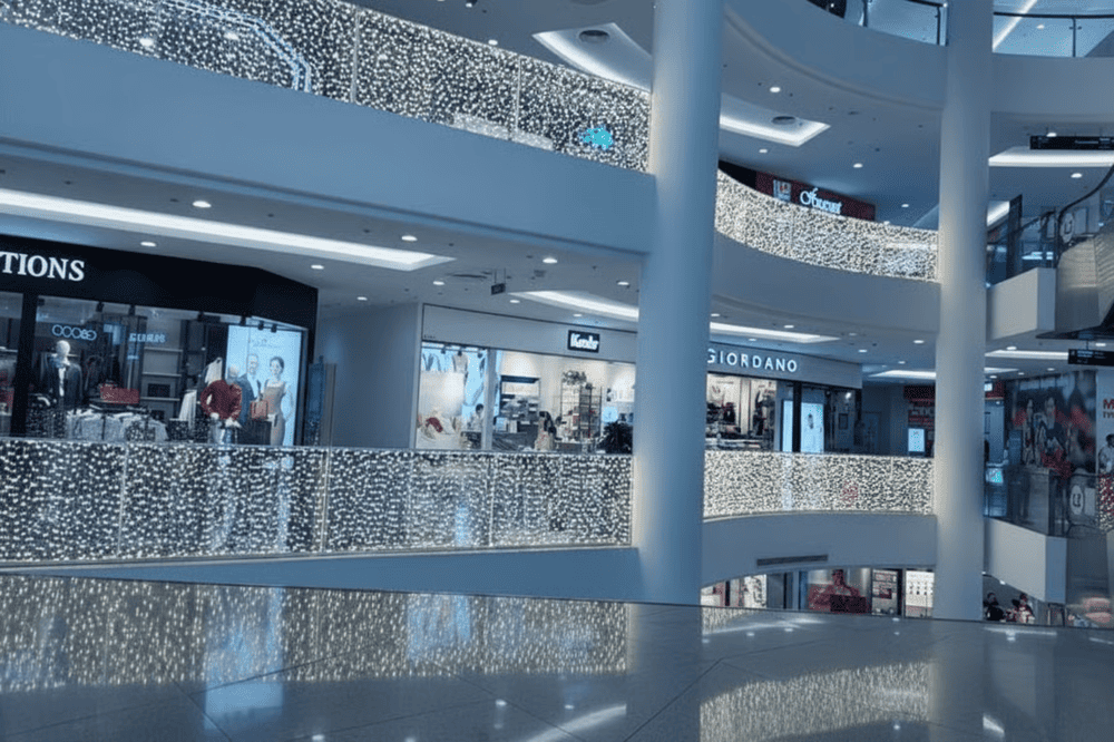 Visitors can explore a shopping mall filled with diverse fashion brands, restaurants, and entertainment services